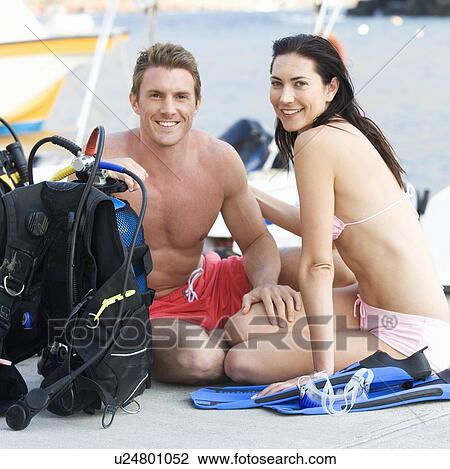A couple checking their scuba diving equipment View Large Photo Image Stock Image - A couple checking their scuba diving equipment. Fotosearch