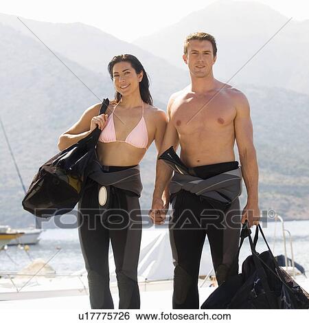 A couple going scuba diving on holiday View Large Photo Image Stock Photograph - A couple going scuba diving on holiday. Fotosearch