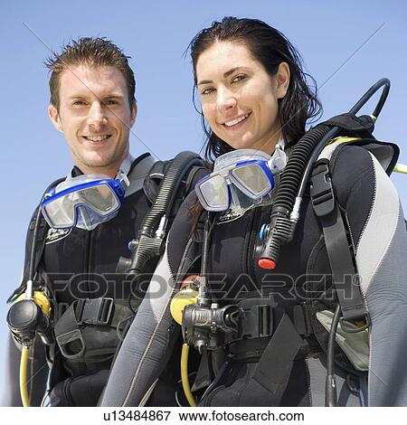 A couple scuba diving View Large Photo Image Stock Photo - A couple scuba diving. Fotosearch