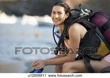 Stock Image - A female scuba diver. Fotosearch