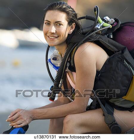 Stock Image - A female scuba diver. Fotosearch