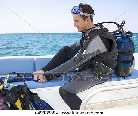 Picture - A man about to go scuba diving. Fotosearch