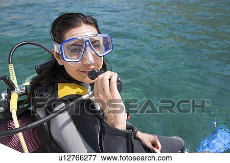 A woman about to go scuba diving View Large Photo Image Stock Photo - A woman about to go scuba diving. Fotosearch