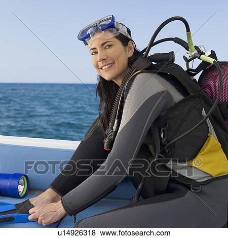 A woman about to go scuba diving View Large Photo Image Stock Photo - A woman about to go scuba diving. Fotosearch