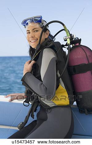 A woman about to go scuba diving View Large Photo Image Stock Photo - A woman about to go scuba diving. Fotosearch