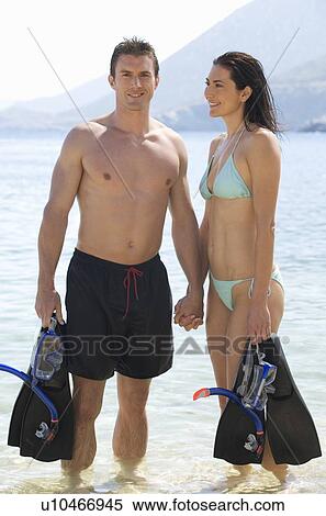 Stock Photography - A couple snorkeling. Fotosearch