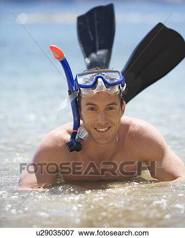 Stock Photo - A man snorkeling. Fotosearch