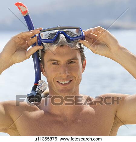 Stock Photograph - A man snorkeling. Fotosearch