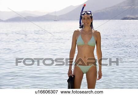 A woman snorkeling in the sea View Large Photo Image Stock Photo - A woman snorkeling in the sea. Fotosearch