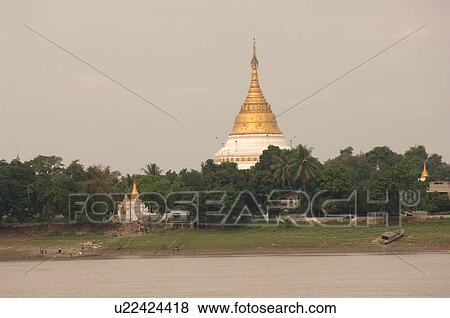 Stock Photo - View of a pagoda from the Irrawaddy River. Fotosearch
