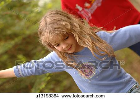 Girl with outstretched arms View Large Photo Image Picture - Girl with outstretched arms. Fotosearch