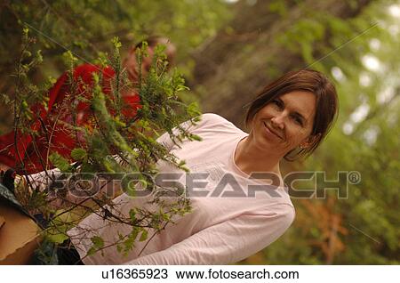 Woman smiling at camera View Large Photo Image Stock Image - Woman smiling at camera. Fotosearch