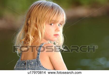 Picture - Young girl looking back. Fotosearch