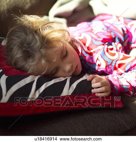 Young girl sleeping on a pillow View Large Photo Image Picture - Young girl sleeping on a pillow. Fotosearch