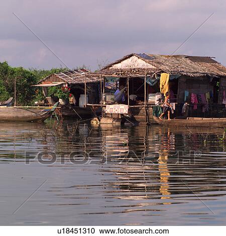 Huts along the water in Cambodia View Large Photo Image Stock Image - Huts along the water in Cambodia. Fotosearch