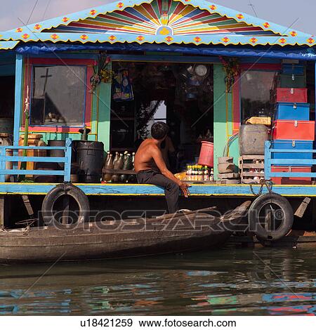 Huts along the water in Cambodia View Large Photo Image Stock Photo - Huts along the water in Cambodia. Fotosearch