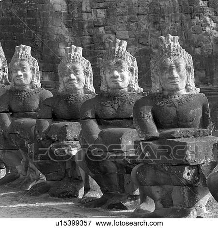 Stock Photo - Large Buddha statues at the Khmer Kingdom palace ruins. Fotosearch