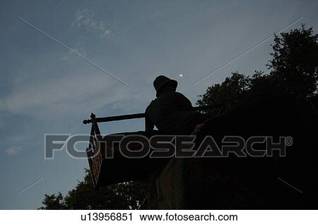 Silhouette of a man riding an elephant View Large Photo Image Stock Image - Silhouette of a man riding an elephant. Fotosearch