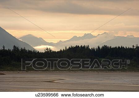 Stock Photograph - Seascape view at sunrise, Pacific Rim National Park, Vancouver Island, Canada. Fotosearch