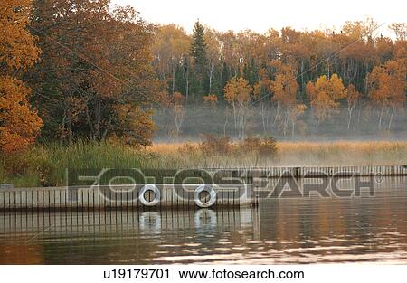 Stock Image - Boat Dock with Mist. Fotosearch