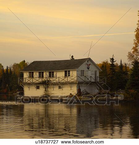 Stock Photo - Boathouse on Lake of the Woods. Fotosearch