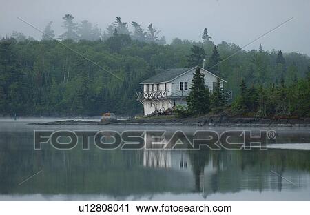 Stock Image - Lake of the Woods at sunrise. Fotosearch