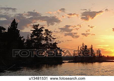 Stock Image - Lake of the Woods at twilight. Fotosearch