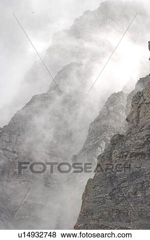 Stock Photo - Fog on Rocky Mountains, Canada. Fotosearch