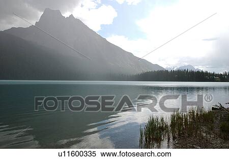 Stock Photography - Lake besides a mountain, Rocky Mountains, Canada. Fotosearch