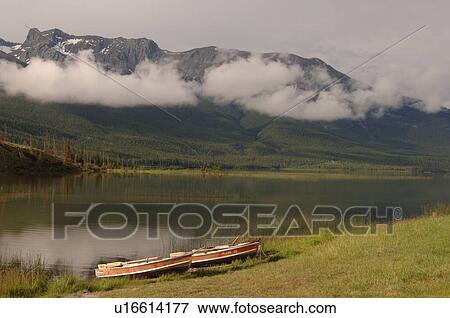 Stock Photo - Row Boats at shoreline of Athabasca River, Jasper National Park. Fotosearch