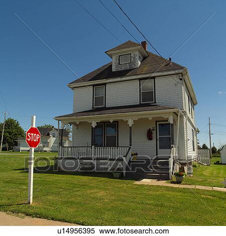 Stock Photography - House with a stop sign on the front lawn in Prince Edward Island, Canada. Fotosearch