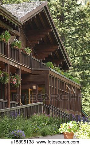 Stock Photo - A cottage in a forest, Rocky Mountains, Canada. Fotosearch