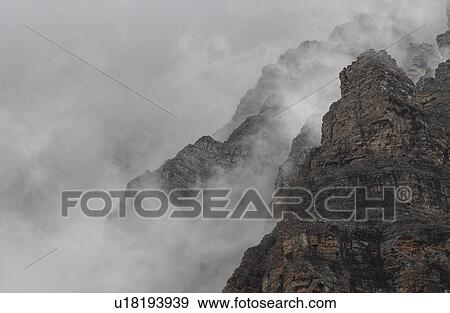 Stock Photo - Fog on Rocky Mountains, Canada. Fotosearch