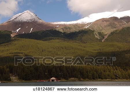 Stock Photo - Mountains overlooking Maligne Lake, Jasper National Park. Fotosearch