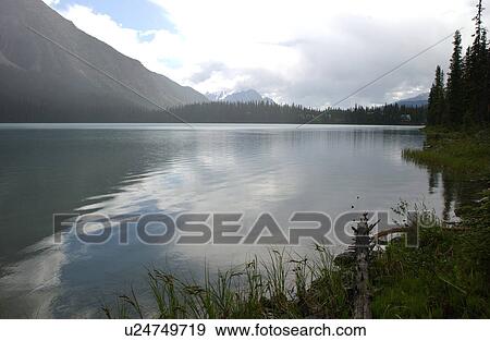 Stock Photo - Panoramic view of a lake, Rocky Mountains, Canada. Fotosearch