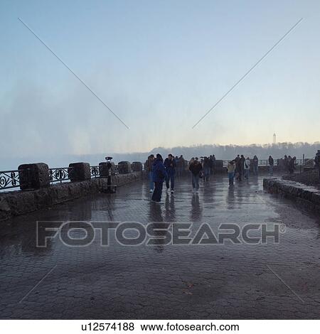 People in mist at Niagara Falls - Ontario Canada View Large Photo Image Stock Photo - People in mist at Niagara Falls - Ontario Canada. Fotosearch