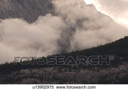 Rocky Mountains with low lying cloud, Jasper National Park, Canada View Large Photo Image Stock Photography - Rocky Mountains with low lying cloud, Jasper National Park, Canada. Fotosearch