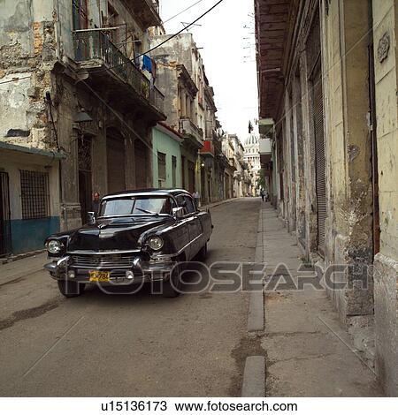 Antique car parked on the street View Large Photo Image Stock Image - Antique car parked on the street. Fotosearch