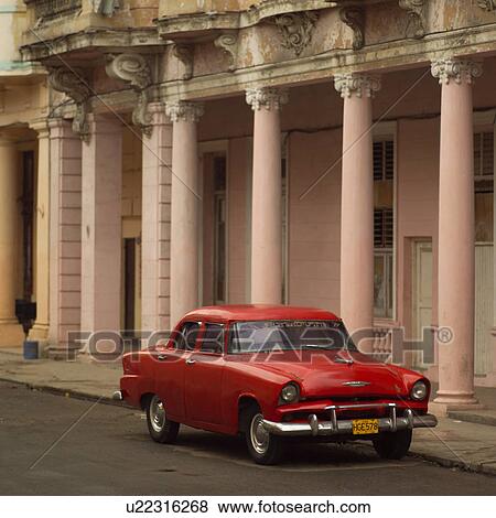 Antique car parked outside a building, Havana, Cuba View Large Photo Image Stock Photo - Antique car parked outside a building, Havana, Cuba. Fotosearch