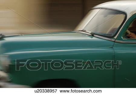 Stock Photo - Close-up of car on a road, Havana, Cuba. Fotosearch