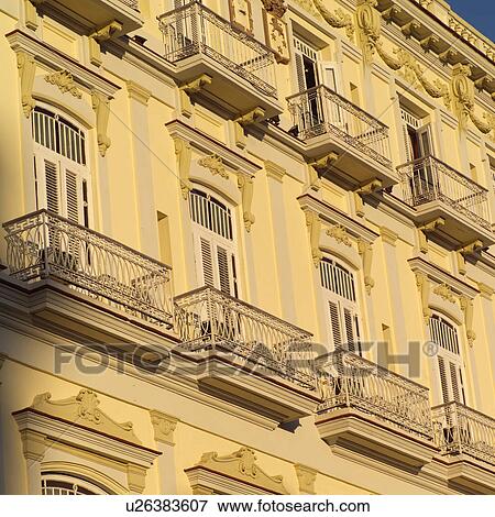 Low angle view of balconys on a building View Large Photo Image Stock Photo - Low angle view of balconys on a building. Fotosearch