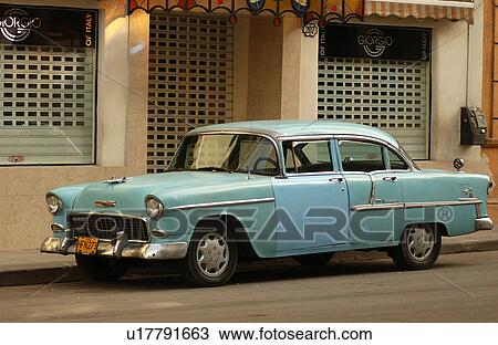 Parked car in front of a building, Havana, Cuba View Large Photo Image Stock Image - Parked car in front of a building, Havana, Cuba. Fotosearch
