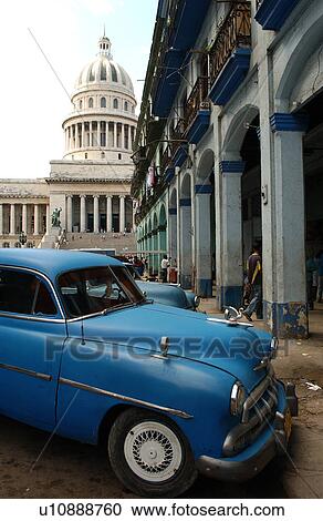 Stock Image - Side profile of a vintage car parked on a street, Havana, Cuba. Fotosearch