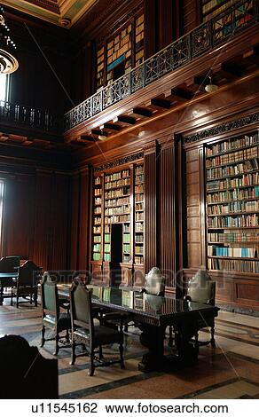 Stock Image - View of table and chairs in an antique library, Havana, Cuba. Fotosearch