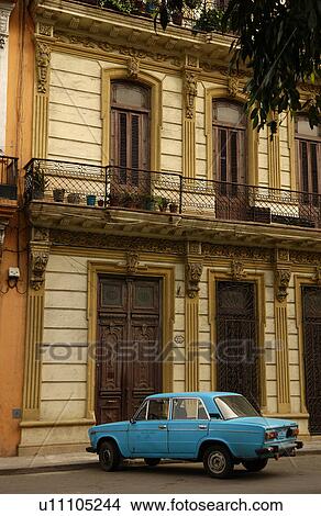 Picture - A car parked in front of a building, Havana, Cuba. Fotosearch