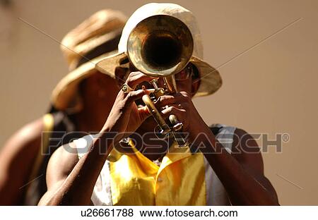 A man playing a trumpet on the streets of Havana, Havana, Cuba View Large Photo Image Stock Photo - A man playing a trumpet on the streets of Havana, Havana, Cuba. Fotosearch