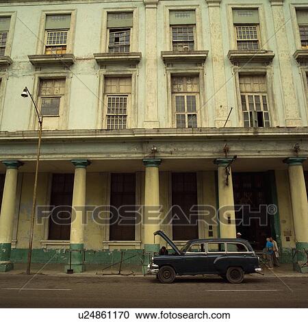 Antique car parked in front of a building, Havana, Cuba View Large Photo Image Stock Image - Antique car parked in front of a building, Havana, Cuba. Fotosearch