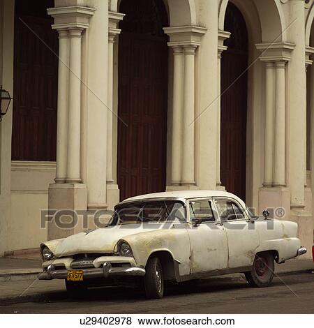Stock Photo - Car parked outside a building, Havana, Cuba. Fotosearch