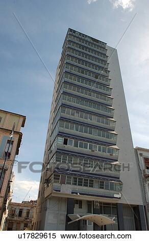 Stock Photography - Low angle view of a commercial skyscraper, Havana, Cuba. Fotosearch