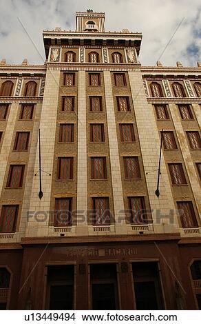 Low angle view of the facade of a commercial building, Havana, Cuba View Large Photo Image Picture - Low angle view of the facade of a commercial building, Havana, Cuba. Fotosearch